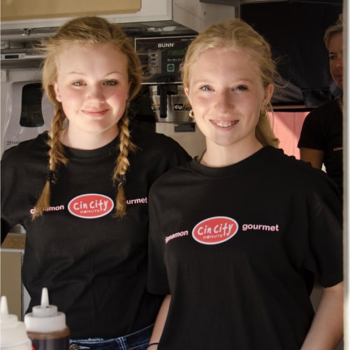 Two girls in a CinCity shirt
