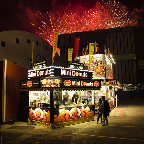 Cin City Donuts trailer at night with fireworks