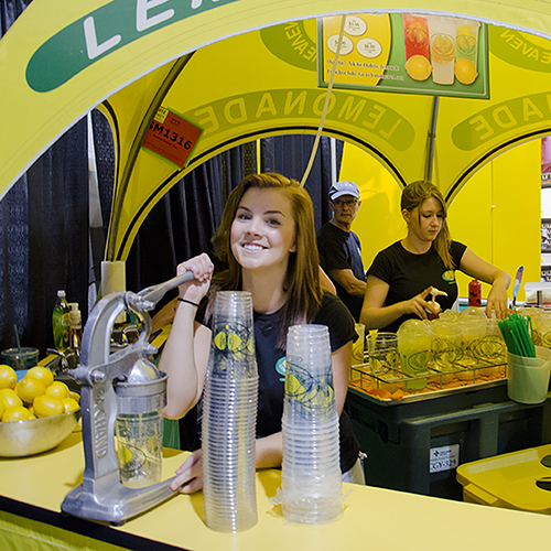 Lemon Heaven employee squeezing lemons